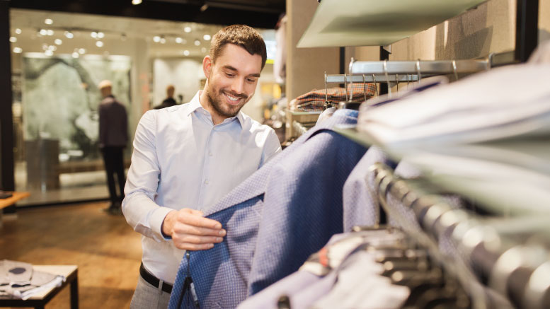 Happy shopper buying clothes